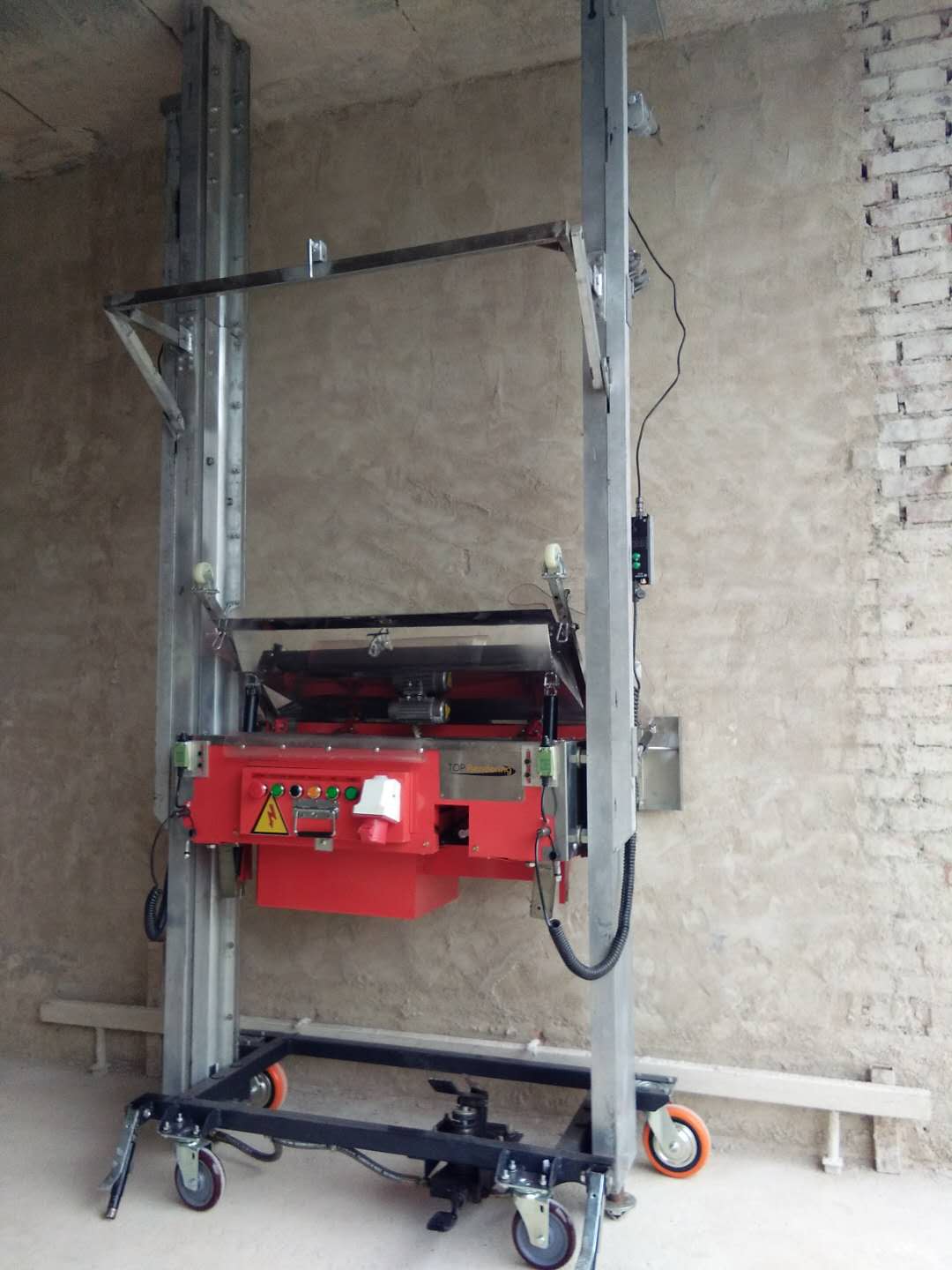 Wall plaster rendering machine